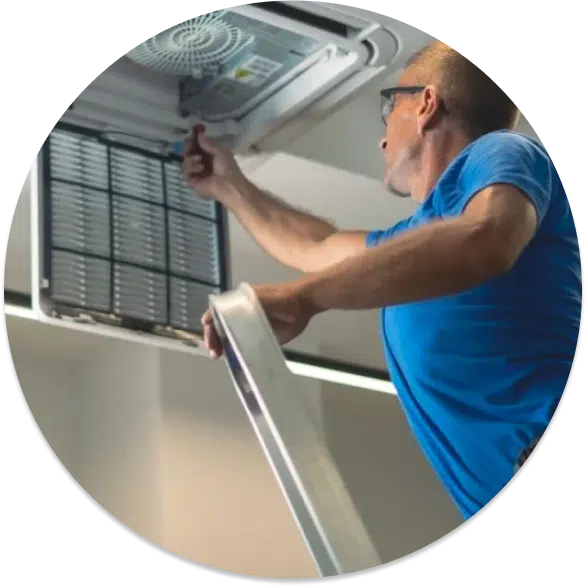 A contractor fixing the hvac system on a San Diego rental home