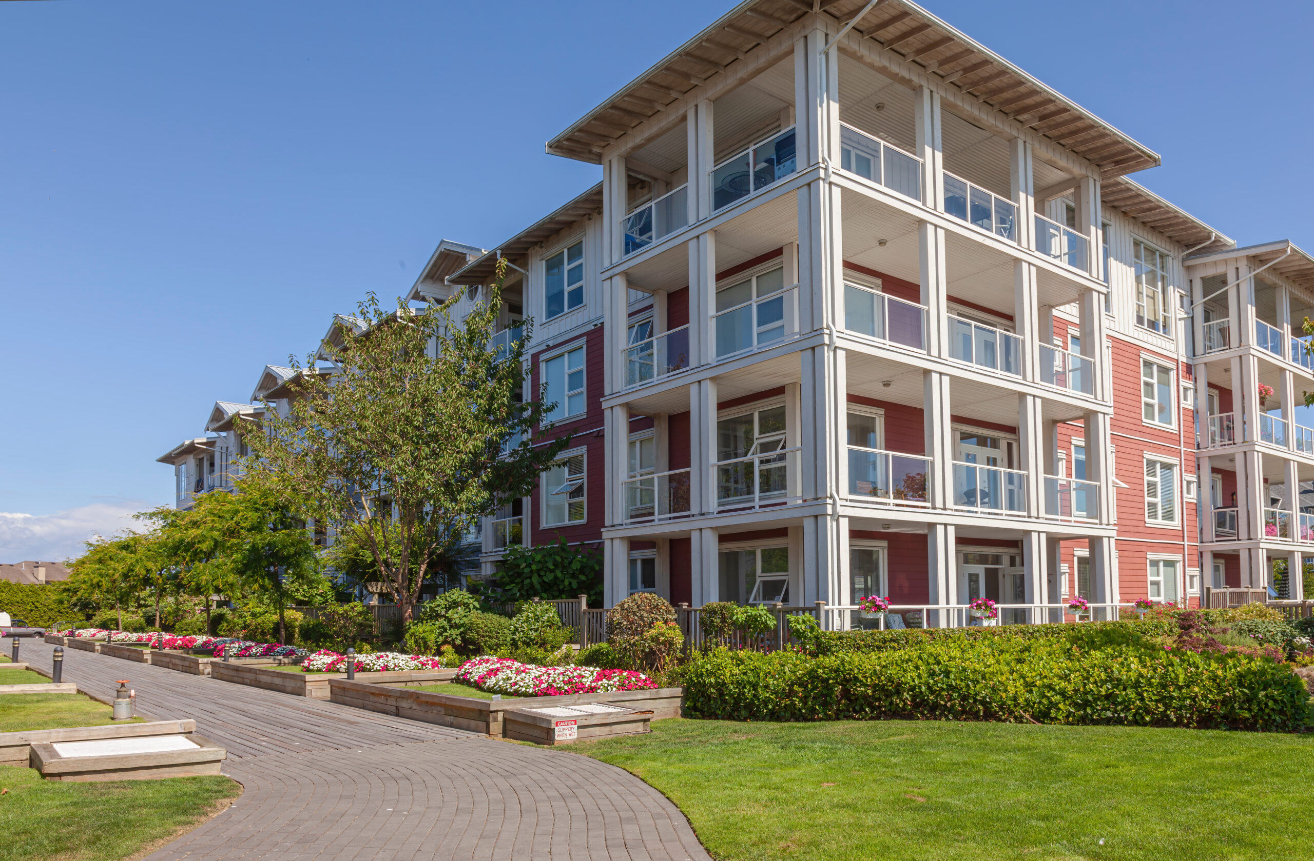 Senior living building made of brick with nice landscaping.